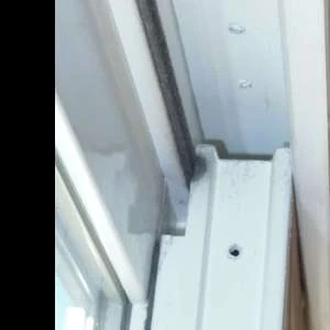 removing the gap at the top of a sliding glass door